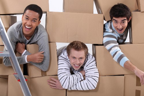 Organized storage space in Westkensington with boxes and furniture