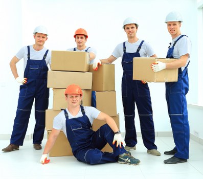 Student removals planning in Westkensington with packed boxes and moving van