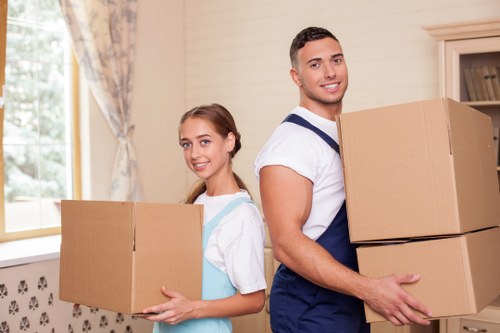 Apartment movers carrying boxes in West Kensington