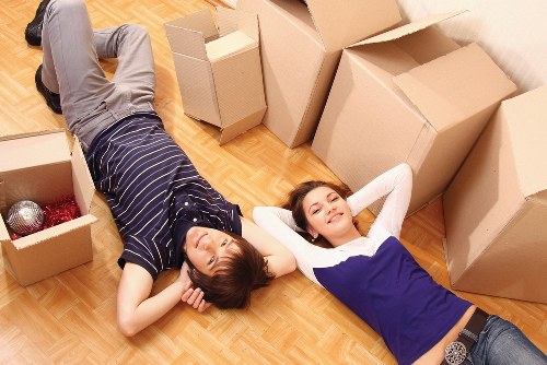 Professional team collecting old sofas and household furniture in Westkensington