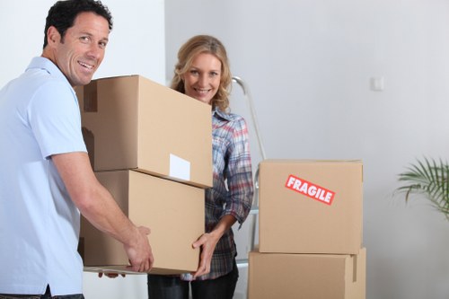 Professional man and van team handling items carefully in West Kensington