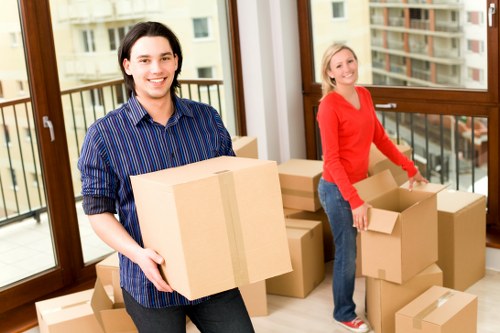 Moving van loading items for same day removals in Westkensington