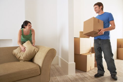 Moving team unloading furniture at a West Kensington property